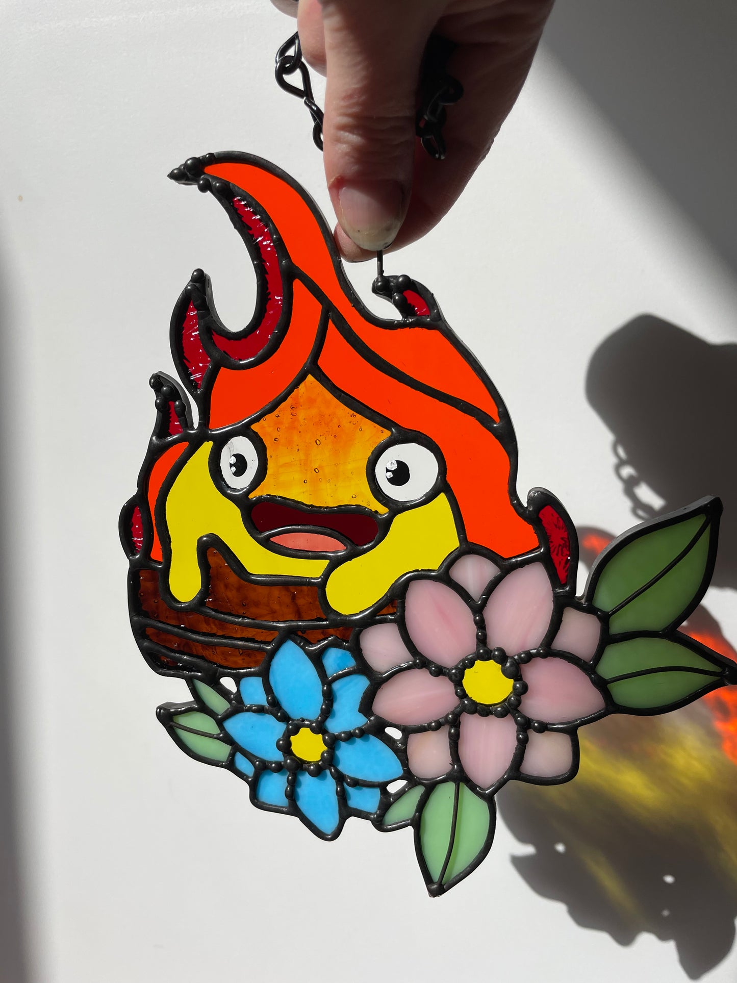 Cutie Calcifer on a Log